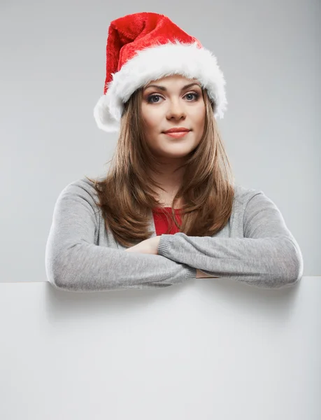 Woman in Santa hat with board — Stock Photo, Image