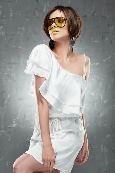 Fashion model posing in white dress — Stock Photo, Image