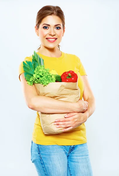 Mujer con comida vegana en bolsa —  Fotos de Stock