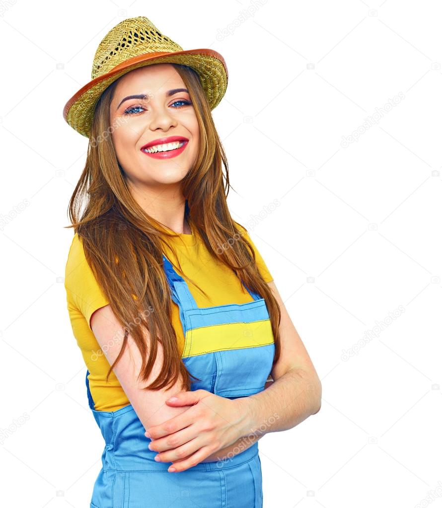 smiling woman wearing coveralls