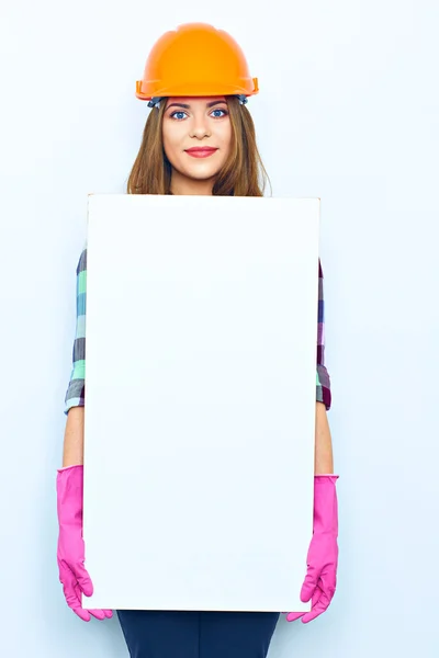 Female builder holding big board — Stock Photo, Image