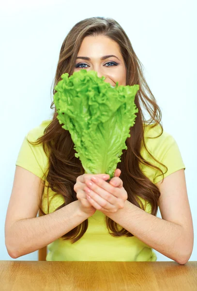 Woman holds green lettuce — Stock Photo, Image