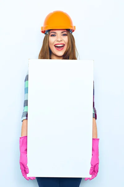 Female builder holding big board — Stock Photo, Image