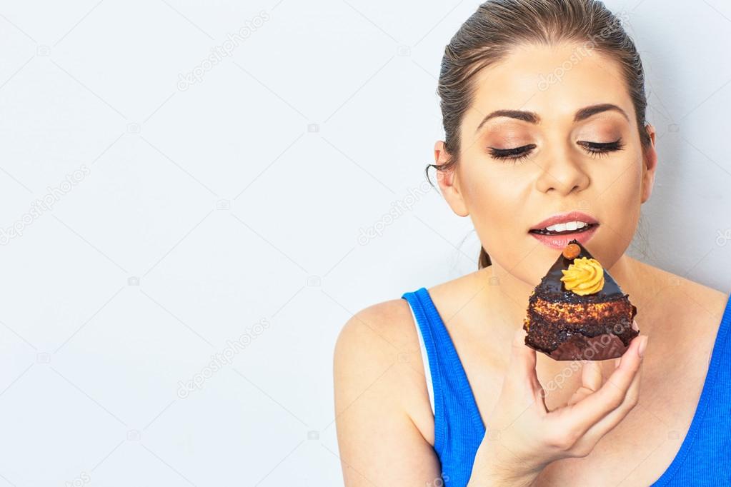 Beautiful woman eating cake