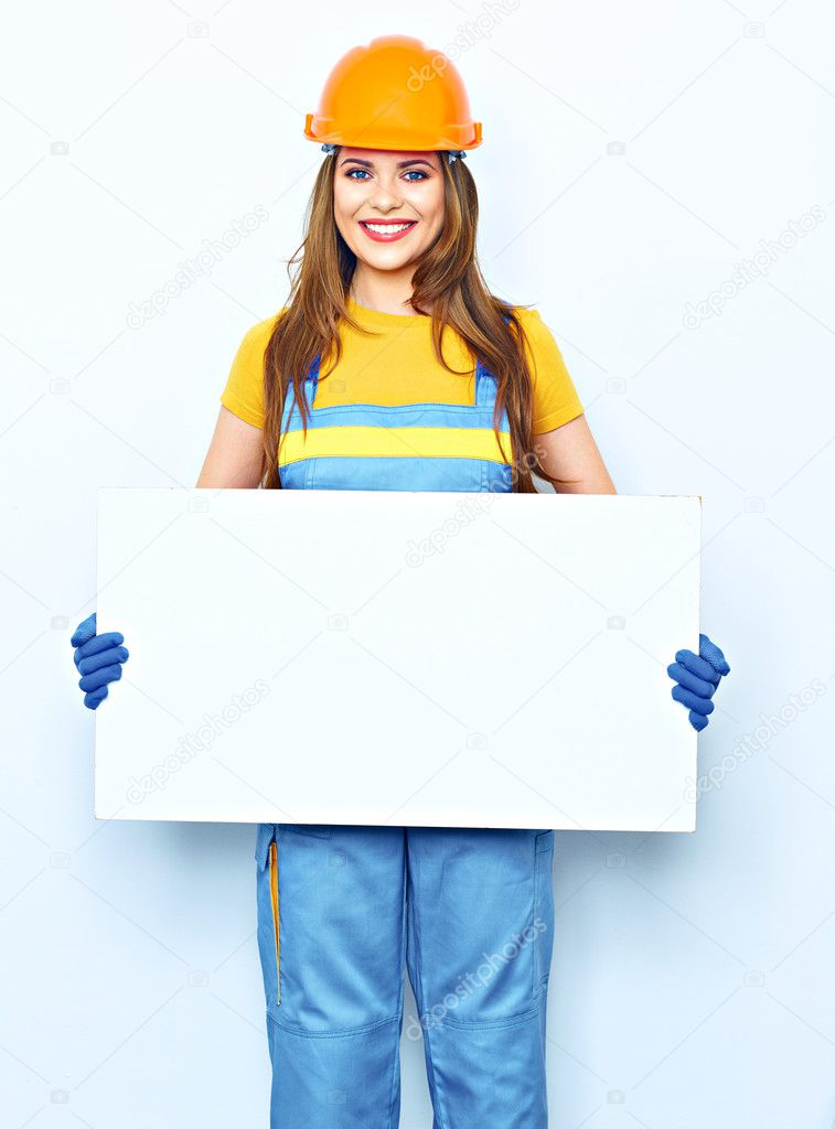 female builder holding big board