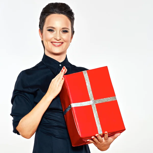 Smiling woman holds red gift box — Stock Photo, Image