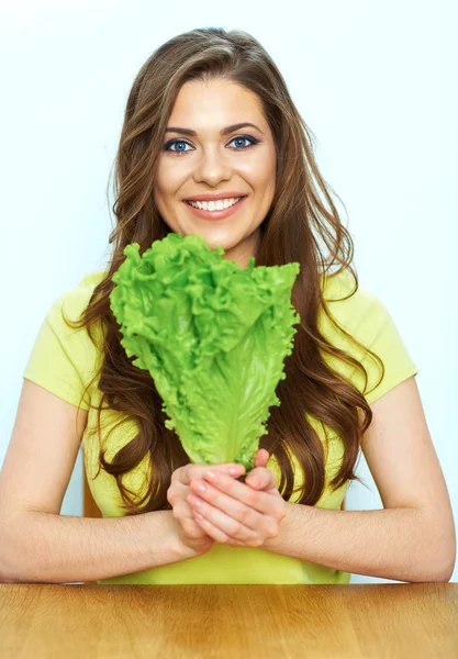 Woman holds green lettuce — Stock Photo, Image