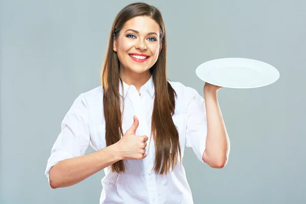 Businesswoman holds empty plate — Stock Photo, Image