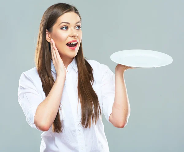 Businesswoman holds empty plate — Stock Photo, Image