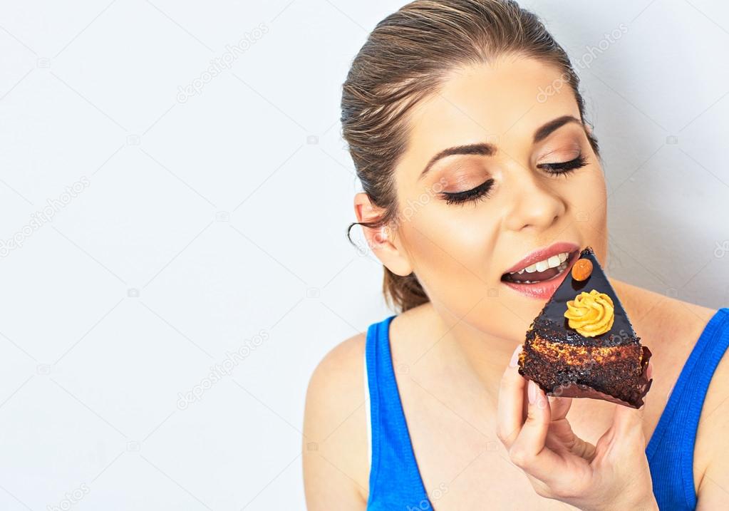 Beautiful woman eating cake