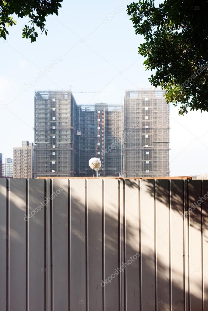 Building Under Construction Behind Safety Barrier