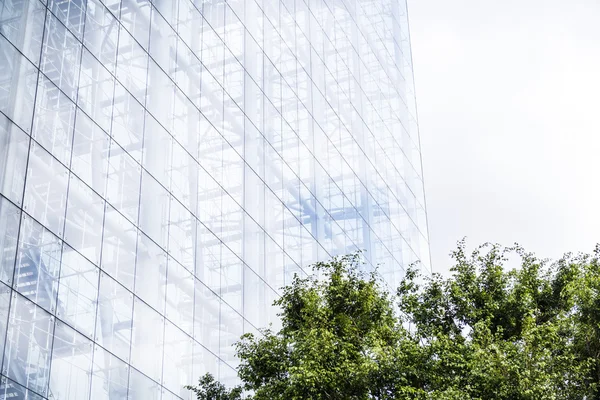 Modern high-rise building with a glass facade — Stock Photo, Image