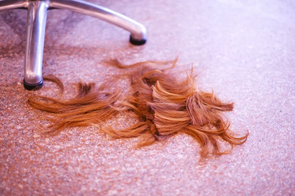 Cut brown hair on floor — Stock Photo, Image
