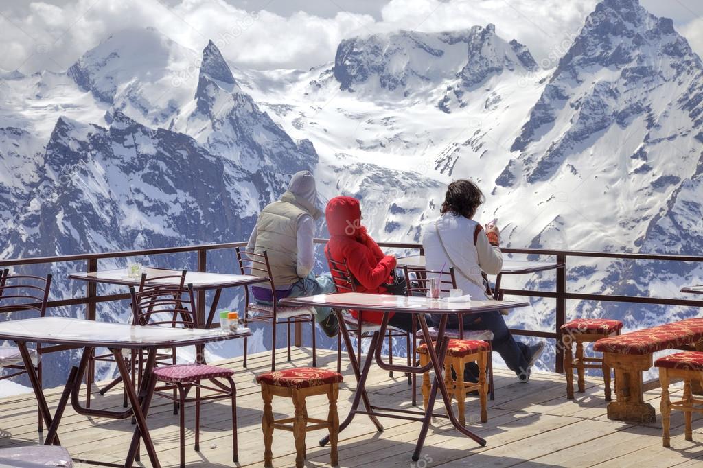 Girls are in an alpine cafe