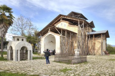 Abhazia. A temple of Dormition of most Holy our Lady is in a vil clipart