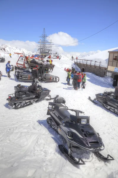 Snowmobiles on the slope of mountain Elbrus