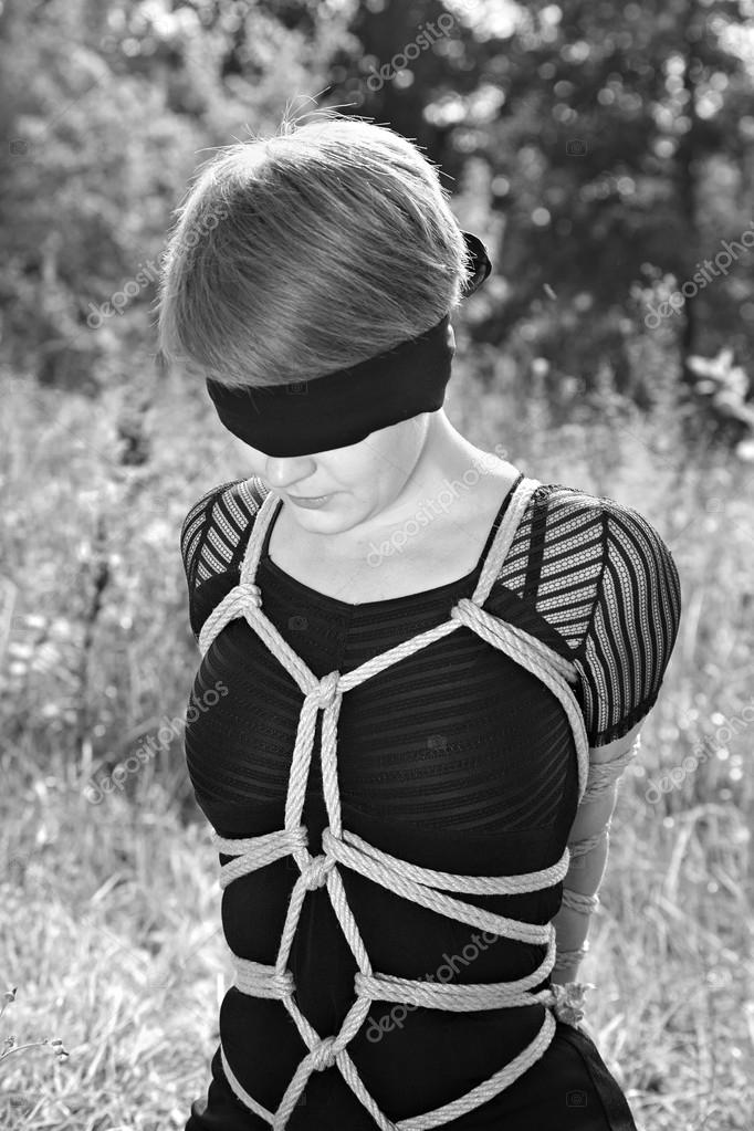 Bound woman with bandage on eyes Stock Photo lenkusa 55352447