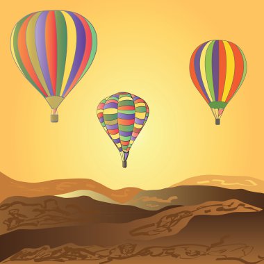 Balonlar çöl üzerinde uçmak. Günbatımı.