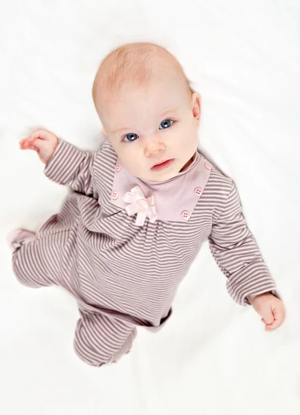 Sweet little baby girl in striped costume — Stock Photo, Image