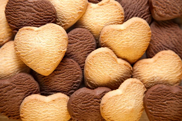 Biscotti a forma di cuore sfondo Immagine Stock