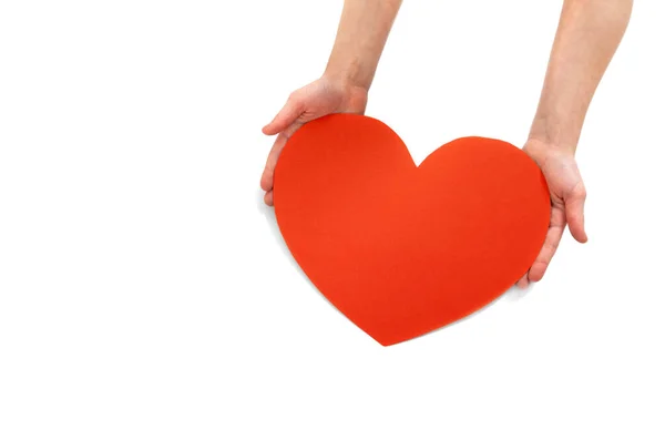 Big red heart in children hands on white background — Stock Photo, Image