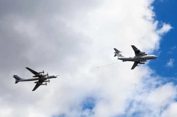 Moscow, Russia, May 7, 2021 - Air tanker Ilyushin IL-78 Midas and turboprop powered bomber Tu-95 Bear simulate in-flight refueling. Rehearsal for the Victory Parade on May 9 Stock Photo