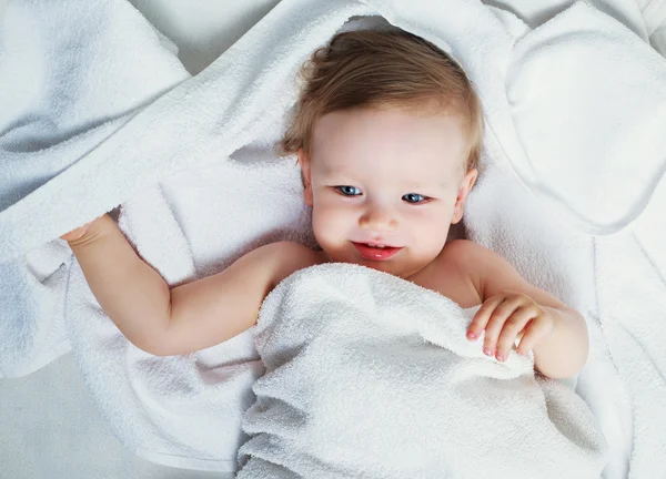 Baby with a towel — Stock Photo, Image