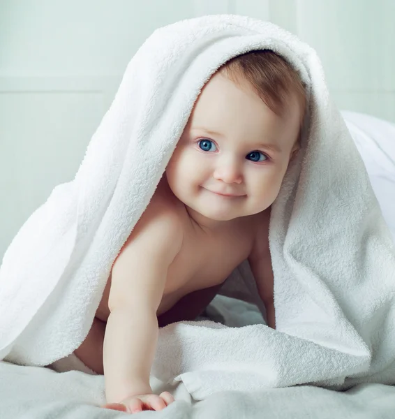 Baby with a towel — Stock Photo, Image