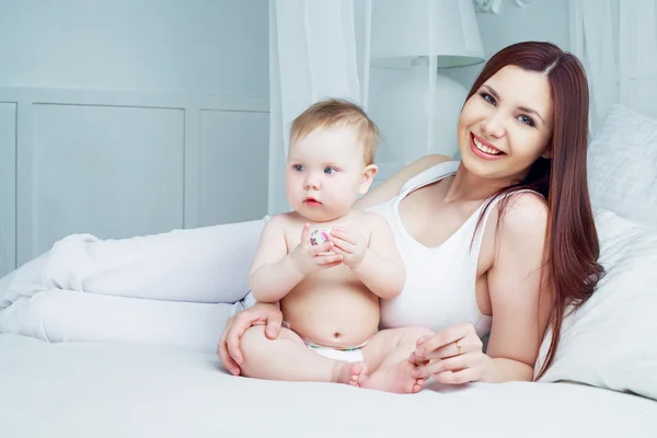 Mother and baby in bed — Stock Photo, Image