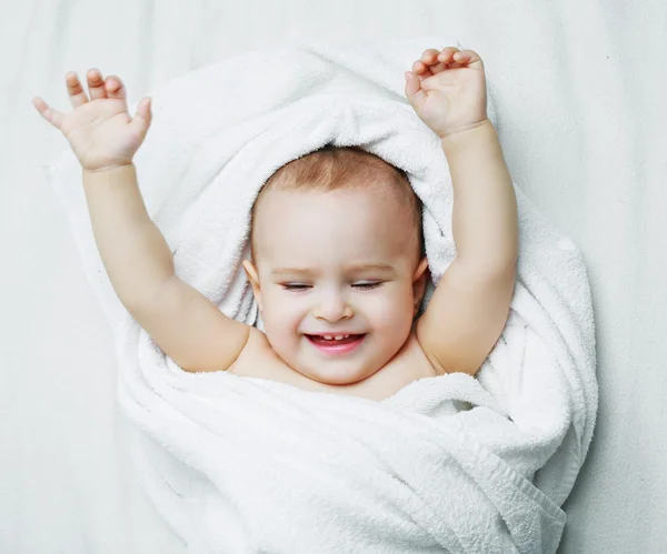 Baby with a towel — Stock Photo, Image