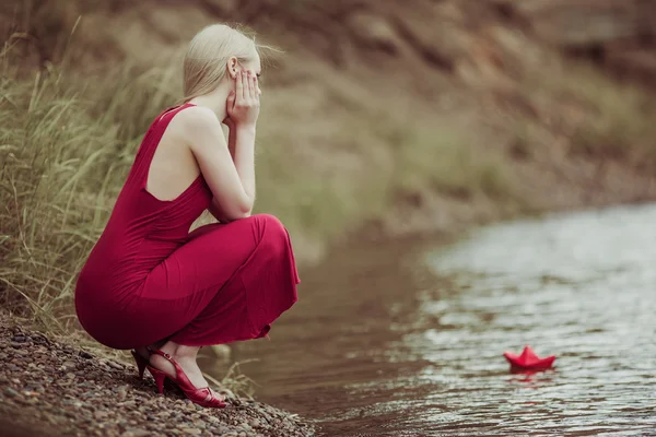 Woman with a paper boat — Stock Photo, Image