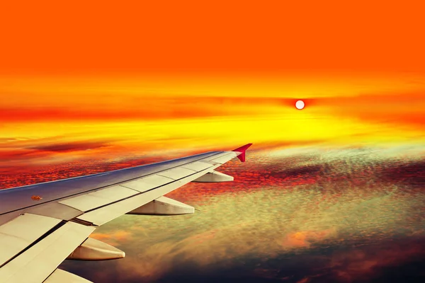 Plane wing above clouds — Stock Photo, Image