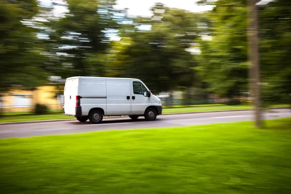 Delivery van moves on road — Stock Photo, Image