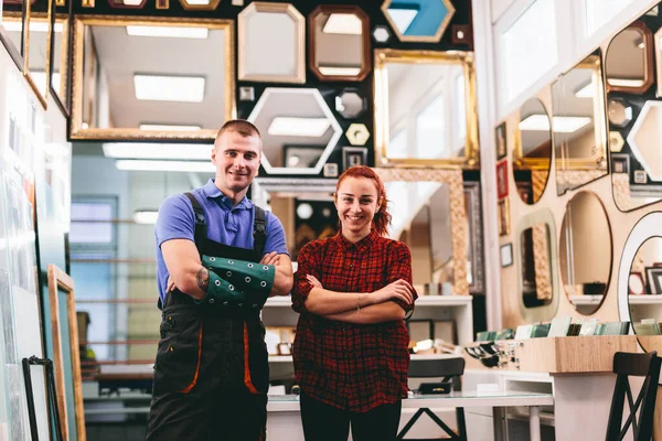 Small business owners portrait. A local mirror shop with handmade frames