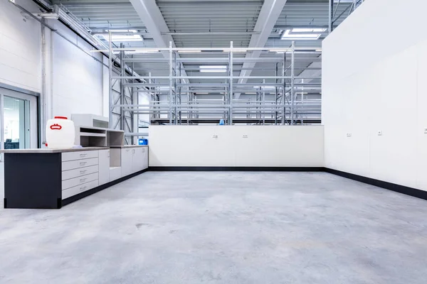 Warehouse office in industrial hall with racking storage racks. Shelving system