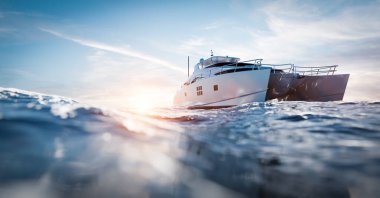 Catamaran motor yacht on the ocean at sunny day clipart