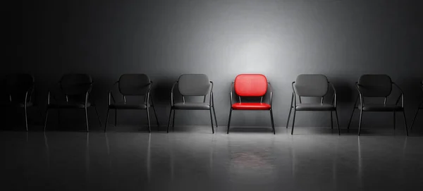 红色椅子成了一排黑色椅子的聚光灯 3D插图 — 图库照片