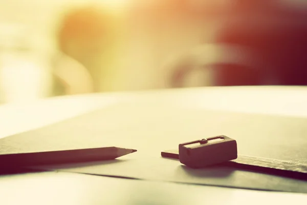 Pencil lying on paper — Stock Photo, Image