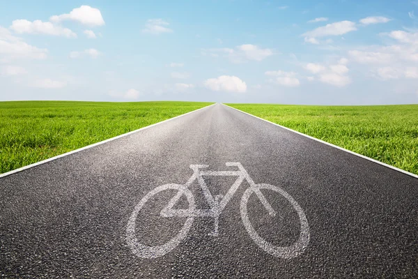 Símbolo de bicicleta na estrada — Fotografia de Stock