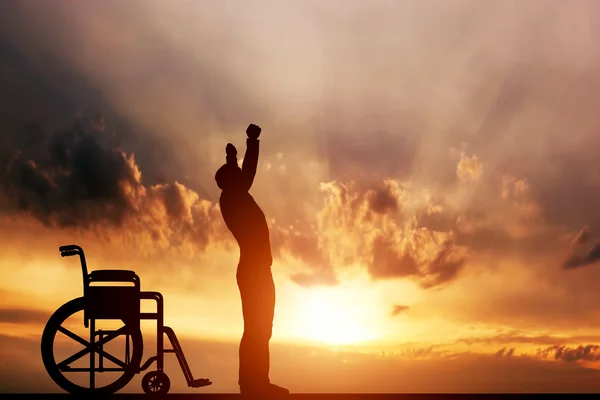 Man standing up from wheelchair. — Stock Photo, Image