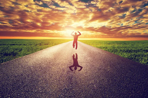 Happy man jumping on road — Stock Photo, Image