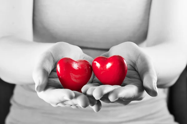 Two hearts in woman hands. — Stock Photo, Image