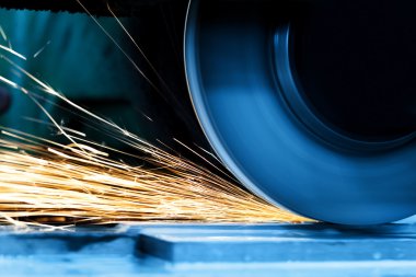 Sparks from grinding machine. clipart