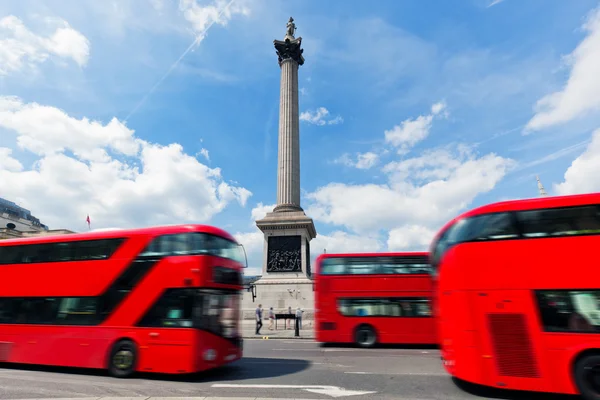 Red buses in motion — Stock Photo, Image