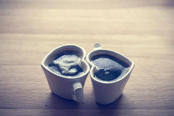 Coffee in heart shaped cups — Stock Photo, Image