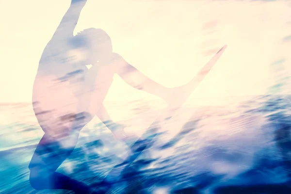 Double exposure of a surfer surfing — Stock Photo, Image