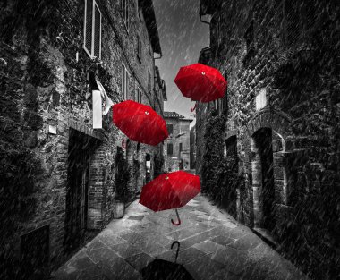 Red umbrellas flying with wind clipart