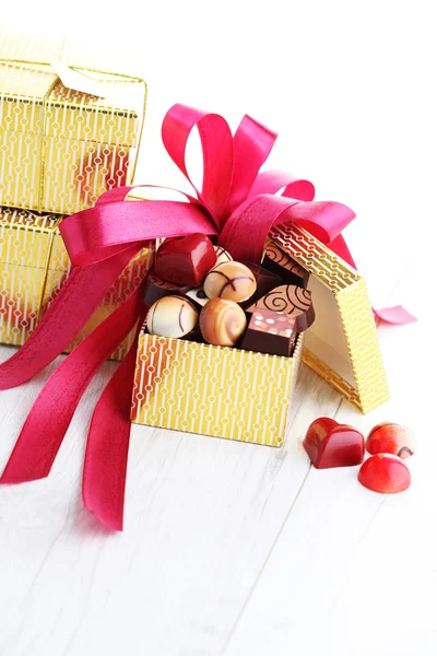 Box of chocolates with red ribbon — Stock Photo, Image