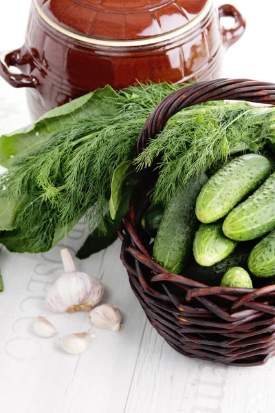 Lots of cucumbers in wicker basket — Stock Photo, Image