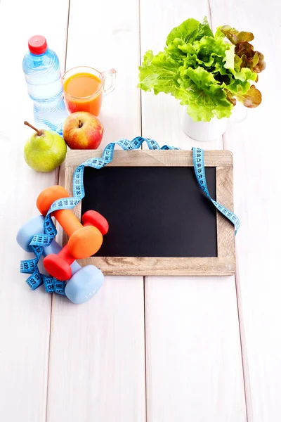Fitness frame with dumbbells and fruits — Stock Photo, Image